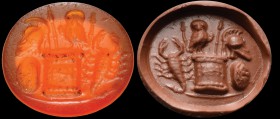 A roman carnelian intaglio. Military emblem. In the center there is a decorated altar, upon which we can see a female owl between two spears; on the l...