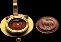 A roman carnelian intaglio, mounted in a modern gold pendant. Bull. The mighty animal, turned to the left, is charging. 2nd century A.D.
Intaglio 10 ...