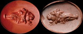 A roman red jasper intaglio. Gryllos. The hybrid composition is made of a boar head joined to a human face in profile and a lion head. Unusual and int...