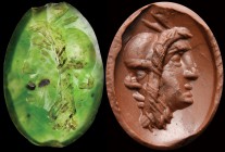 A roman green chalcedony intaglio. Gryllos. The hybrid combination is made of a sylenus head and a Pan head. Apotropaical intaglio, related to the rus...