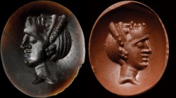 A roman republican intaglio in dark brown agate. Actor with mask. The young character, turned to the left, is showing the theater mask (oriented up, a...