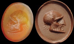 A roman carnelian intaglio. Theater mask. The comical effigy of an old man, turned to the left, is engraved searching for a strong realism in the depi...