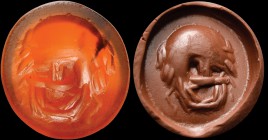A roman carnelian intaglio. Theater mask, of an old character, nearly facing. 2nd century A.D.
8,5 x 9 x 2 mm.