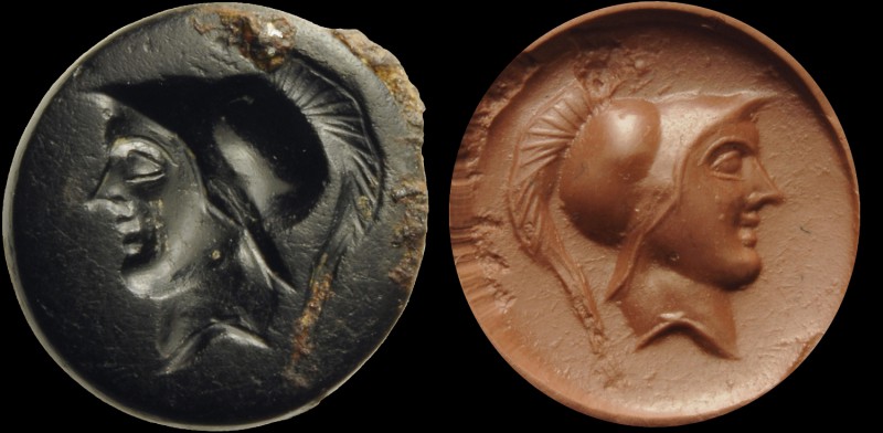 A roman republican black agate intaglio. Helmeted head. Signs of the ancient iro...