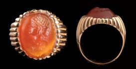 A rare, hellenistic carnelian intaglio, mounted in a modern gold ring. Portrait bust of a Ptolemaic queen. The royal effigy is laureate and in profile...