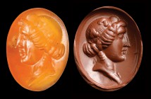A roman carnelian intaglio. Head of Dionysus. The god is turned to the left, and is characterized by long and tied hair, adorned with heart-shaped ivy...