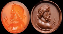 A roman carnelian intaglio. Bust of Aesculapius. The god, bearded and laureate, is turned to the left, with shoulders in three quarters, and seen from...