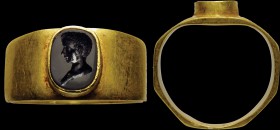 A fine, roman black agate intaglio, mounted on an ancient gold ring. Bust-private portrait of a young man. The effigy is certainly attributable to a m...