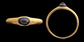 A roman gold ring, with a three-layer nicolo-agate bezel. Smooth stone, with no engravings on, and of a high and slightly sharp profile. 2nd century A...