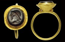 A roman garnet intaglio mounted in an ancient gold ring. Men's head in profile, to the left. Light wear marks. 2nd-3rd century A.D.
intaglio 9 x 10 m...