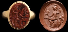 A roman red jasper intaglio, mounted in a modern gold ring. Athena. The goddess is holding the spear in her right hand, holding up a victory with the ...