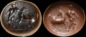 A roman double-layer onyx intaglio. Warrior with horse. The helmeted figure, armed with spear and particularly muscled, pulls with him a reluctant hor...