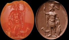 A roman carnelian intaglio. Mars. The god, standing, turned to the right, is holding a sceptre in his left hand and a shield with the right one; he is...