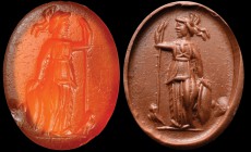 A roman carnelian intaglio. Athena. The goddess, helmeted and draped, turned to the right, is holding a spear in her left hand and a shield (on the gr...