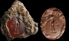 A roman carnelian intaglio. Bonus eventus. The naked male character is holding two wheat ears; usually he hands out a patera (in this case covered by ...