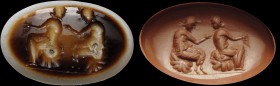 A double-layer, roman agate intaglio. Pan and Syrinx. The Faun, sitting on a rock, is touching the back of the nymph, who is sitting on a rock too, in...
