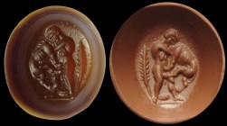 A roman nicolo-agate intaglio. Hercules and the nemean lion. The hero is fighting against the lion, strangling it with his arms. Next to him, a palm b...