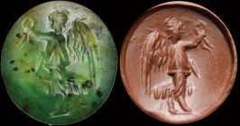 A roman, green chalcedony intaglio. Winged victory. The figure, draped and turned to the left, is holding a palm branch in her right hand, while lifti...