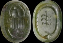 A roman magic jadeite intaglio. Gnostic symbologies. The bezel, of a slightly truncated conical shape, shows a scarab on the smaller face; on the bigg...
