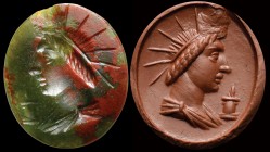 A roman striped jasper intaglio. Bust of Helios. The god, turned to the left, is wearing a tunic and a big solar crown; in front of the bust there is ...
