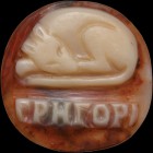 A roman, double-layer agate intaglio. Sleeping dog, with inscription. The animal, in its typical pose, with legs folded below, sleeps with its head ly...
