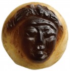 A roman, double-layer agate cameo. Facing head. The effigy, attributable to an apotropaical mask, has been engraved in the brown higher layer, on a li...