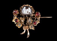 An agate cameo, mounted on a floral victorian brooch with diamods and rubies. Mythological scene. The cameo is presumably a late-antique roman work, p...
