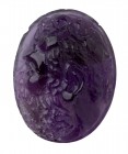 An amethyst cameo. Head of a Silenus. The face of the corpulent Silenus is turned to the left, and characterized by a coronet of ivy leaves, tied on t...