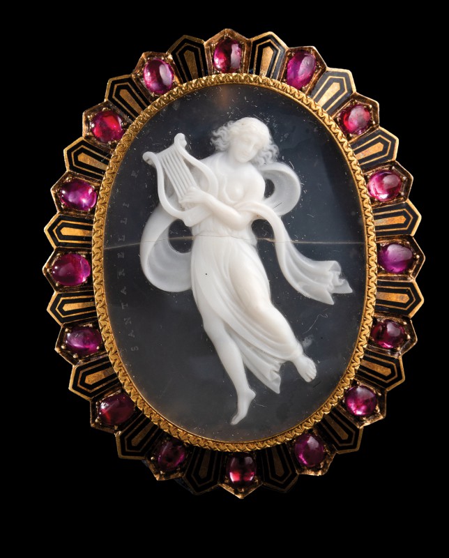An agate cameo by G.A. Santarelli, mounted in a precious gold brooch with enamel...