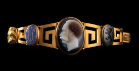 A big, triple layer agate cameo by L. Merley, mounted on an important bracelet in gold and enamels. Private male portrait. The character, to be identi...