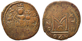 Arab Byzantine. Umayyad Caliphate, circa AD 685-693. Fals (bronze, 4.48 g, 21 mm), Dimashq (Damascus). Crowned Byzantine-style emperor seated facing o...