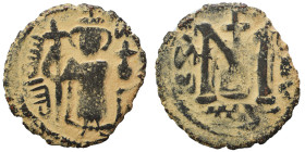 Arab Byzantine. Umayyad Caliphate. Fals (bronze, 3.63 g, 20 mm), (Emesa) Hims. Standing Imperial figure, holding long cross; KAΛON to right, bism alla...
