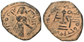 Arab Byzantine. Umayyad Caliphate. al-Malik ibn Marwan, AH 65-86 / 685-705 AD. Fals (bronze, 2.89 g, 22 mm), 'Standing Caliph' type. Caliph standing f...