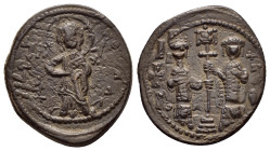 CONSTANTINE X DUCAS.(1059-1067).Constantinople.Follis.

Obv : +EMMA NOVHA.
Christ standing facing on footstool, wearing nimbus and holding Gospels, IC...