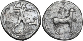 Greek Italy. Bruttium, Kaulonia. Fourreè Stater, c. 475-425 BC. Obv. Apollo, nude, advancing right with a laurel branch in his upraised right hand and...