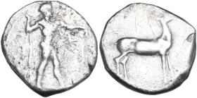 Greek Italy. Bruttium, Kaulonia. AR Stater, 400-388 BC. Obv. Apollo striding right, hurling branch. Rev. Stag standing right. HN Italy 2062; HGC 1 142...