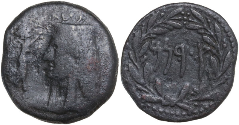 Sicily. Cossura. AE 22 mm. Struck c. 2nd century BC. Obv. Bust of Isis left, wea...
