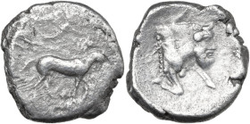 Sicily. Gela. AR Tetradrachm, 430-425 BC. Obv. Charioteer driving slow biga right; above, Nike flying right and crowning horses. Rev. Forepart of man-...