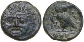 Sicily. Kamarina. AE Tetras, 425-405 BC. Obv. Gorgoneion facing. Rev. Owl standing left, head facing, wings closed, holding lizard; in exergue, three ...