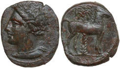 Punic Sicily. AE 15 mm, late 4th-early 3rd century BC. Obv. Head of Tanit left, wearing wreath of grain. Rev. Horse standing right before palm tree. S...