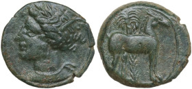 Punic Sicily. AE 15 mm, late 4th-early 3rd century BC. Obv. Head of Tanit left, wearing wreath of grain. Rev. Horse standing right before palm tree. S...