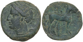 Punic Sicily. AE 15 mm, late 4th-early 3rd century BC. Obv. Head of Tanit left, wearing wreath of grain. Rev. Horse standing before palm tree right. S...