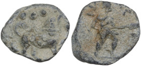 The Roman Empire. PB Tessera, 1st century BC-1st century AD. D/ Dog standing right, head upwards; above, three pellets. R/ Standing figure right, hold...