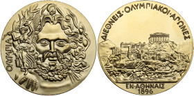 Greece. Prize medal for the 1st modern Olympic Games in Athens, 1896. Obv. Facing head of Zeus Olympios, holding Nike on globe; Nike holding a large o...