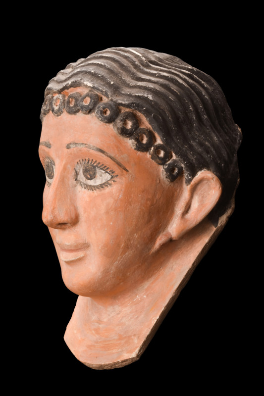 Roman Period, ca. 30 BC - 323 AD.
A moulded ceramic funerary mask of a wealthy R...