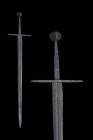 Ca. 1250-1520 AD.
This fine Medieval sword features a pommel of an unusual design. It is circular when viewed from the front and sides, but displays a...