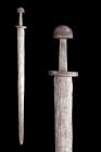 Ca. 900-1000 AD.
An iron sword In excavated condition, with a broad double-edged blade, the hilt comprising thick ovoidal cross-piece, flat slightly t...