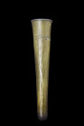 Ca. 500-700 AD.
This conical-shaped vial, crafted from exquisite pale green glass. Tapering to a rounded base, the vessel is adorned with a mouth feat...