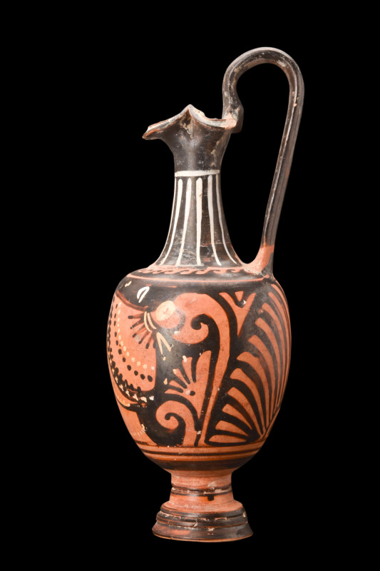 Southern Italian, ca. 400 BC.
A beautiful terracotta oinochoe with flaring trefo...