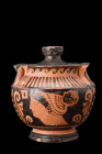 Ca. 400-350 BC.
A red-figure stamnos, a squat vessel adorned with black glaze and red decorative elements. This stamnos features a corseted neck with ...